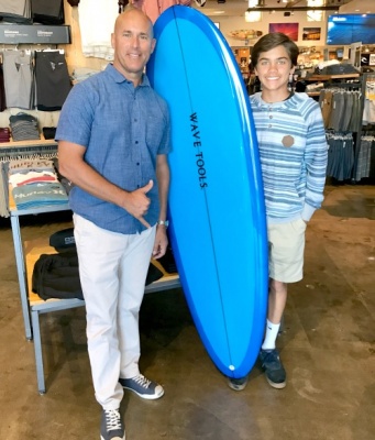 Arbor Real Estate Gives Away Wave Tools Surfboard to Local Student